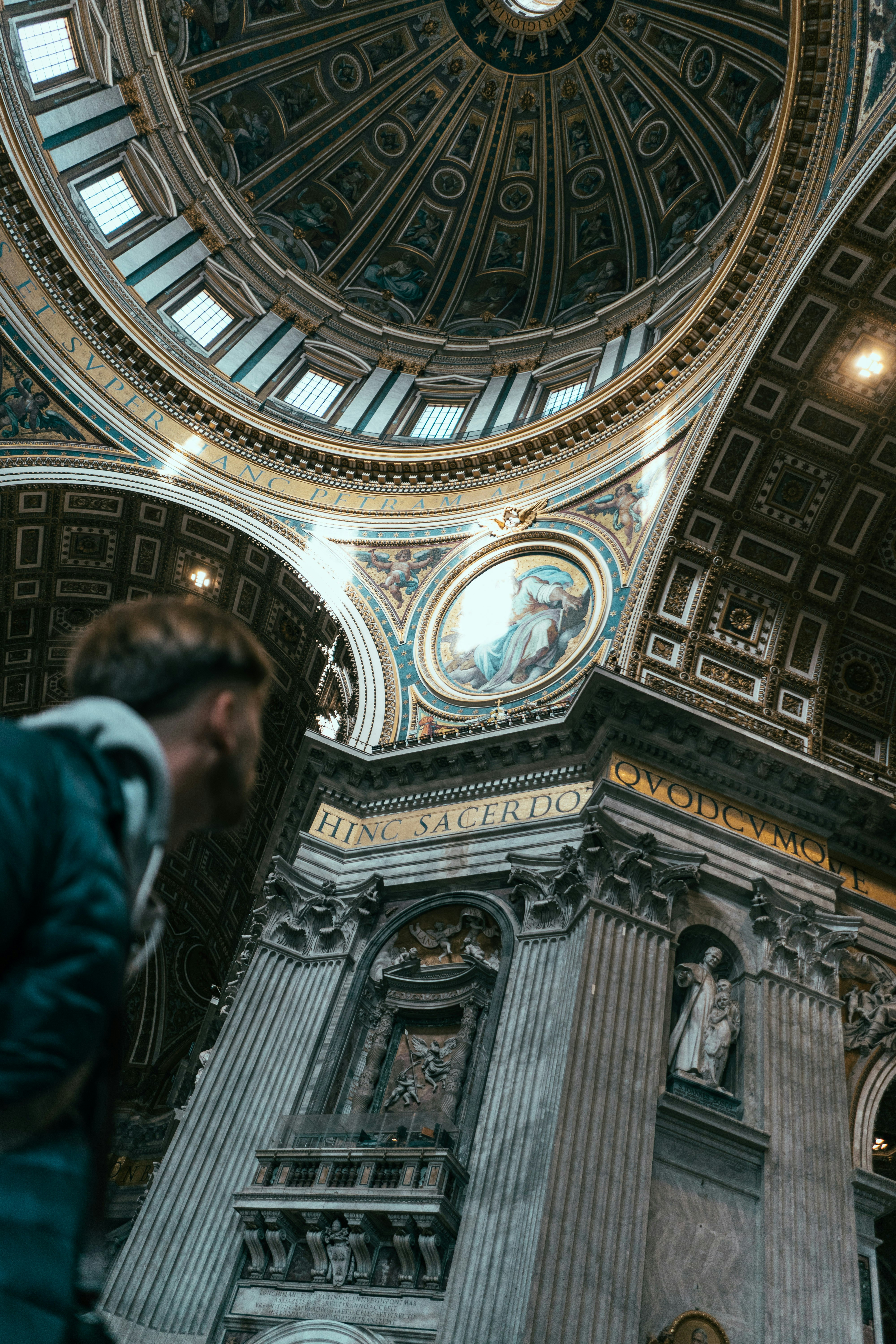 people walking inside white and gray dome building